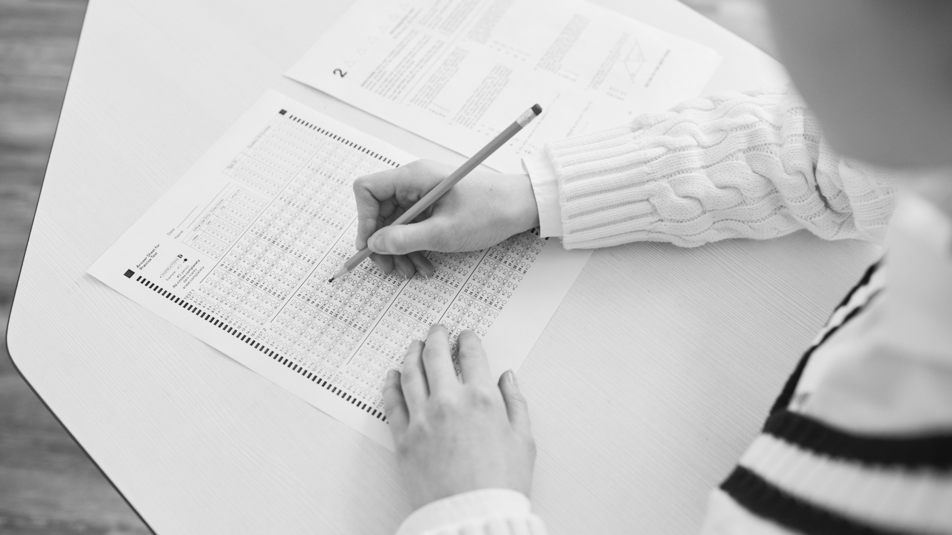person filling in an assessment - What an IT Maturity Assessment Tells a Small Business