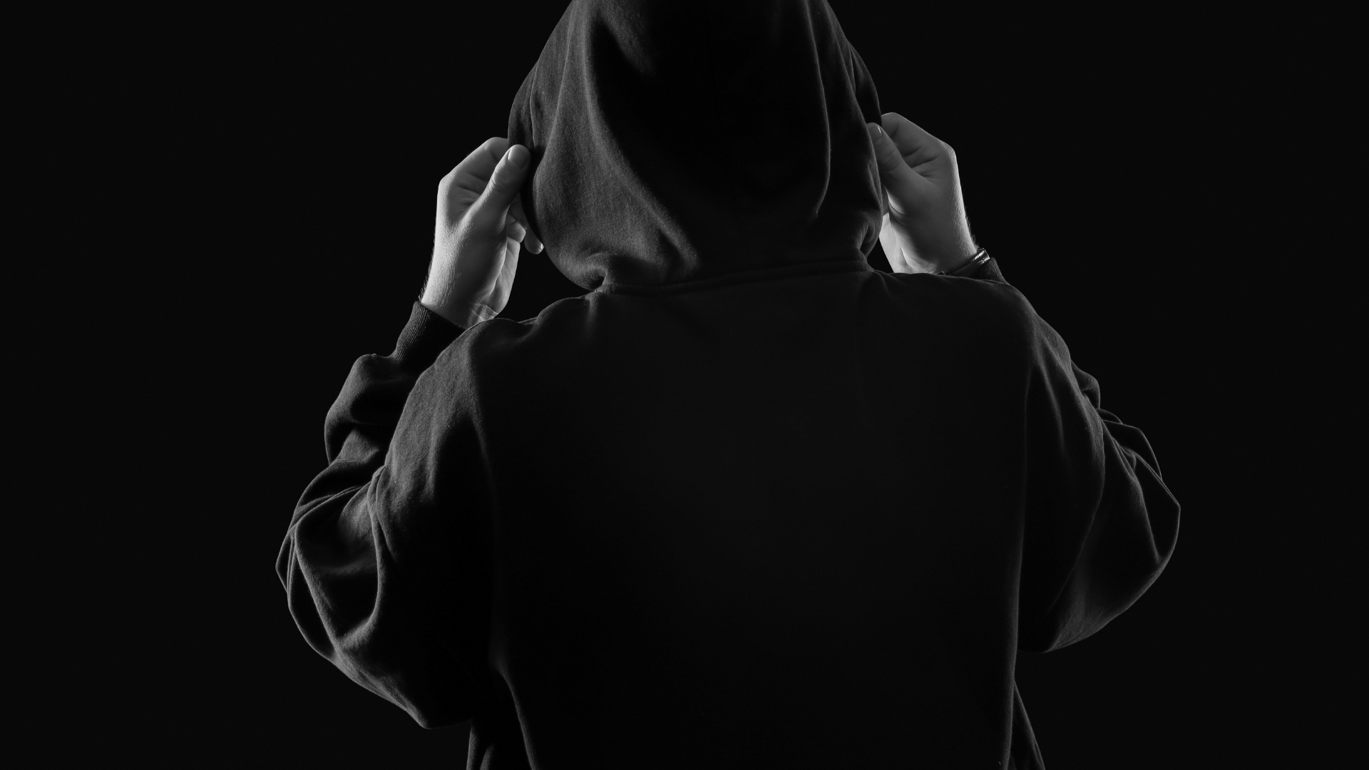 person in a hood - How to Find Shadow AI in a Small Business